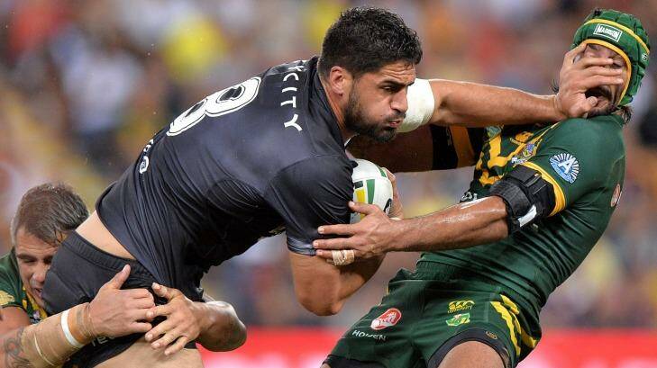 Jesse Bromwich of the Kiwis pushes away Australian superstar Johnathan Thurston during the Anzac Test in Brisbane. Photo: Bradley Kanaris/Getty Images