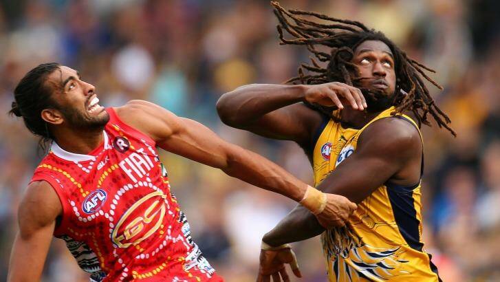 Tom Nicholls of the Suns and Nic Naitanui of the Eagles contest the ruck during the round 10 AFL match between the West Coast Eagles and the Gold Coast Suns. Photo: Paul Kane
