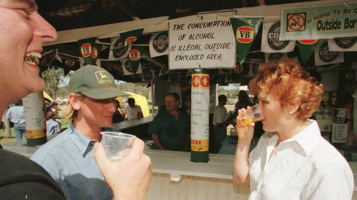 Pauline Hanson drinks with locals at the annual Linville Picnic Races. Photo: Dean Sewell