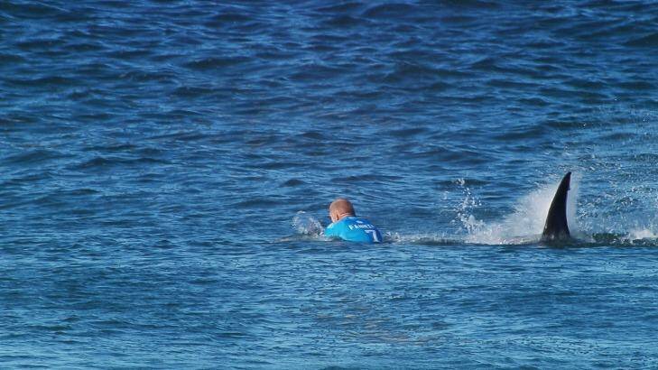 Close call: Mick Fanning is attacked by a shark. Photo: Supplied