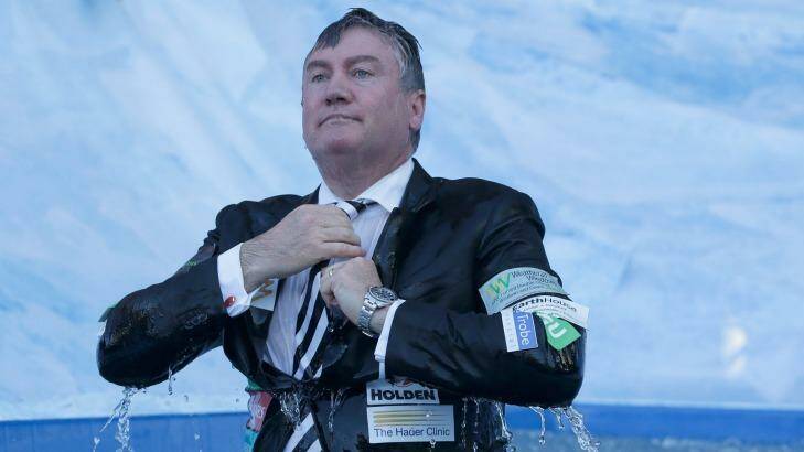 Eddie McGuire after sliding into a bath of icy water at the MCG last Monday. Photo: Darrian Traynor