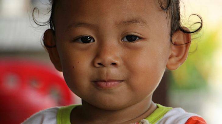 A child in Khmounh, where there are a large number of children in keeping with Cambodia's high national birth rate.  Photo: Craig Skehan