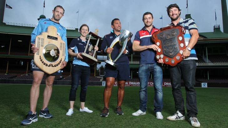 State of domination: NSW cricketer Ben Rohrer, NSW Breakers' Rachael Haynes, Waratahs assistant coach Daryl Gibson and former NRL stars Anthony Minichiello and Nathan Hindmarsh hold aloft their sporting trophies at the SCG. Photo: Louise Kennerley