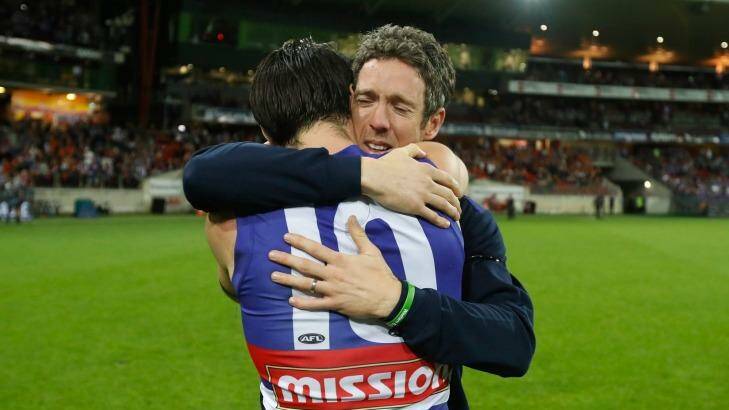 Injured Bulldogs skipper Bob Murphy embraces his stand-in, Easton Wood, after the game. Photo: AFL Media/Getty Images