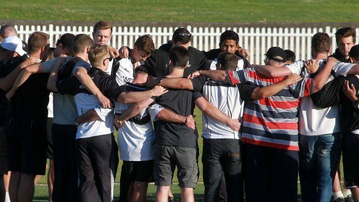 Emotion: Western Suburbs players gather at Pratten Park to remember Phillip Hughes.