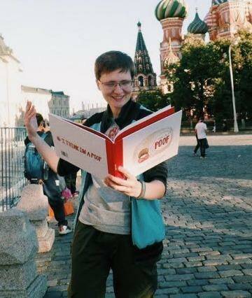 A russian LGBT activist reads <i>I Think I'm a Poof</i> in Moscow. Photo: Supplied