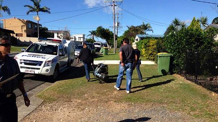 Police outside a Southport home which was raided on Tuesday as part of an investigation into an alleged drug syndicate. Photo: Nine News