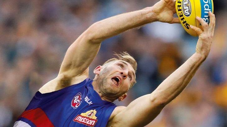 Good fit: Travis Cloke admires what Luke Beveridge and the Bulldogs have achieved. Photo: Digitally altered image