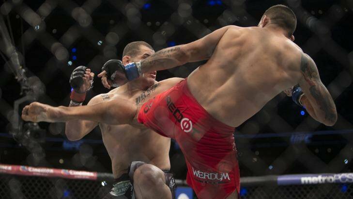 United States' Cain Velasquez, left, battles against Brazil's Fabricio Werdum for the UFC heavyweight title. Photo: Christian Palma