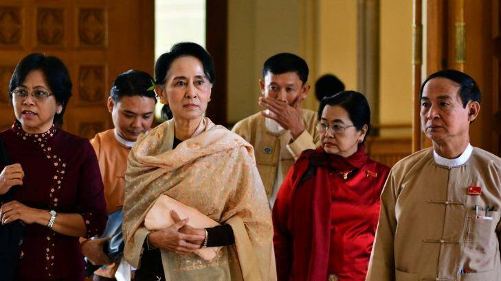 Myanmar opposition leader Aung San Suu Kyi, centre, leaves along with lawmakers after the final session of Myanmar's out-going parliament. Photo: Aung Shine Oo
