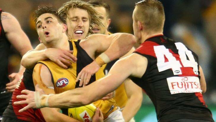 Hold it right there: Anthony Miles of Richmond is tackled by Dyson Heppell.