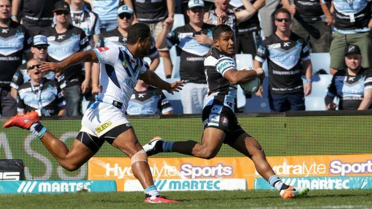 Catch me if you can: Ben Barba goes in to score for the Sharks. Photo: John Veage