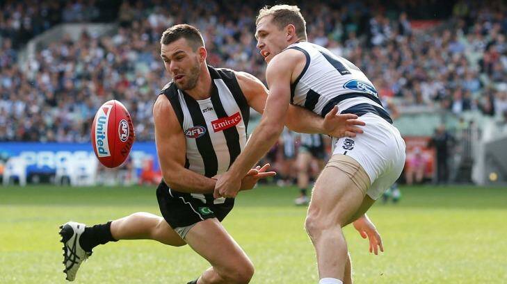 Levi Greenwood of the Magpies and Joel Selwood compete for the ball. Photo: AFL Media/Getty Images