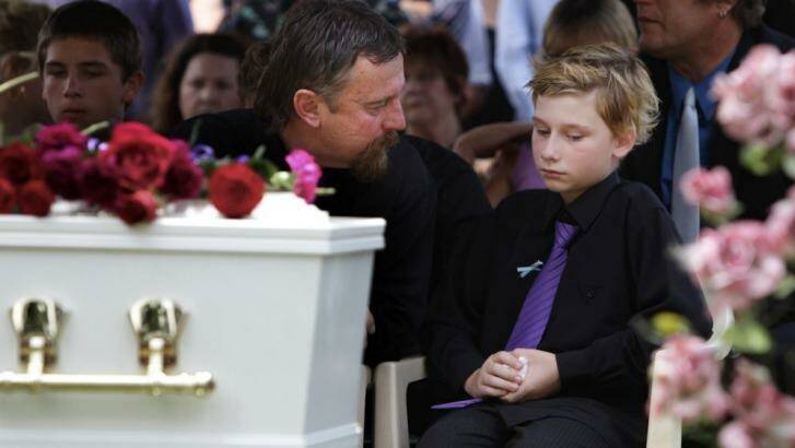 Jordan's father John and the brother he saved, Blake, at the teenager's funeral. Photo: Jacky Ghossein