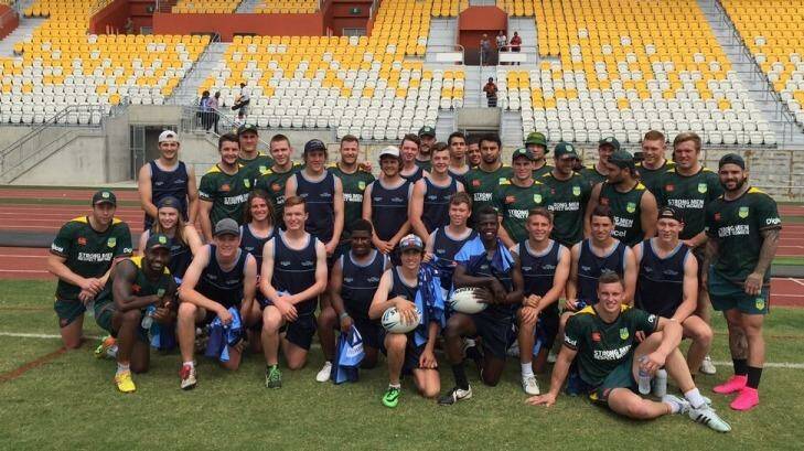 Team bonding: The Prime Minister's XIII and NSW U16 Young Achievers team in Port Moresby, Papua New Guinea.  Photo: Daniel Potuku/NRL
