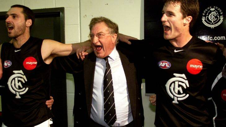 John Elliott enjoys a rare win with Carlton players in 2002. Photo: Vince Caligiuri