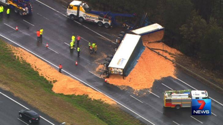 A truck rollover at Murrumba Downs spilled wood chips on the Bruce Highway and delayed traffic during the afternoon rush. Photo: Seven News