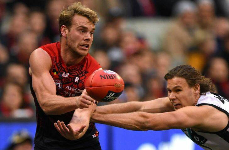 Jack Watts of the Demons (left) and Jared Polec of the Power contest during the Round 18 AFL match between the Melbourne Demons and the Port Adelaide Power at MCG in Melbourne, Saturday, July 22, 2017. (AAP Image/Julian Smith) NO ARCHIVING, EDITORIAL USE ONLY