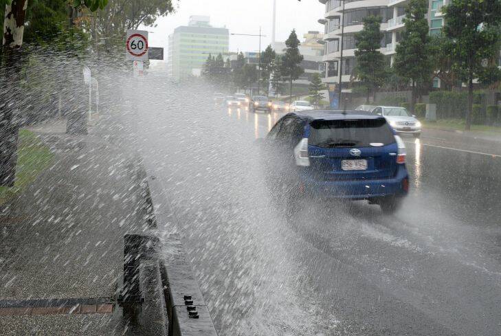 BRISBANE, AUSTRALIA - FEBRUARY 20:  Water is seen across the road on Coronation Drive at Milton, on February 20, 2015 in Brisbane, Australia. Heavy rain caused by tropical Cyclone Marcia.  (Photo by Bradley Kanaris/Fairfax Media)