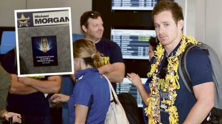 Michael Morgan, arriving at Townsville Airport on Monday and, inset, the quote inspired by his late teammate Alex Elisala. Photography Brendan Esposito Photo: Brendan Esposito