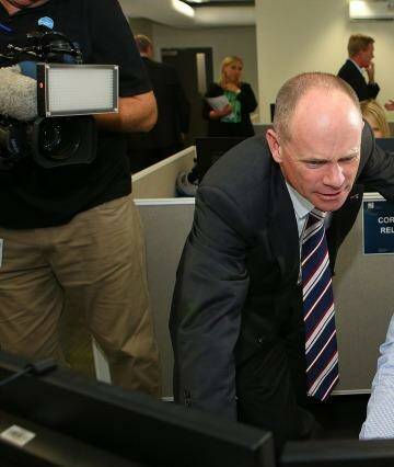 Premier Campbell Newman and Mick Smith, CCTV manager, meet at the G20 operations room at Brisbane Airport. Photo: Chris Hyde