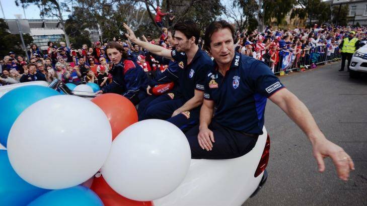 Luke Beveridge shared the joy of the parade with his players. Photo: Justin McManus 