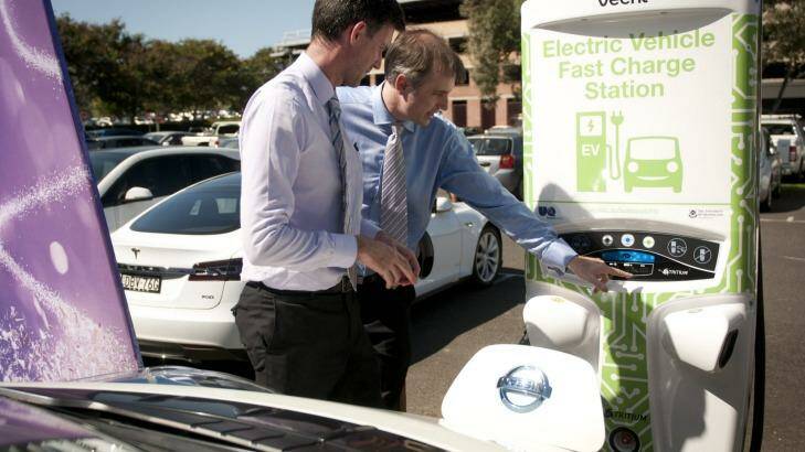 Energy Minister Mark Bailey with Tritium managing director Dr David Finn at the charging station. Photo: Robert Shakespeare