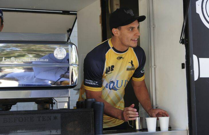 Sport. Brumbies player, Matt Toomua serving his team mates from his coffee truck outside GIO Stadium before the Captain's Run.
February 25th 2016
The Canberra Times
Photograph by Graham Tidy.