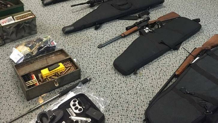 A number of weapons, including 15 firearms, were uncovered during raids across far north Queensland Photo: Queensland Police Service