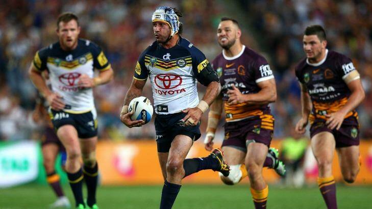 Premium viewing content: Johnathan Thurston makes a break during the 2015 NRL Grand Final between the Brisbane Broncos and the North Queensland Cowboys at ANZ Stadium. Photo: Cameron Spencer