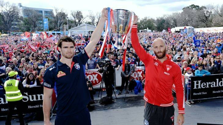 Bulldogs captains Easton Wood and the Swans' Jarod McVeigh hold the premiership cup. Photo: Justin McManus