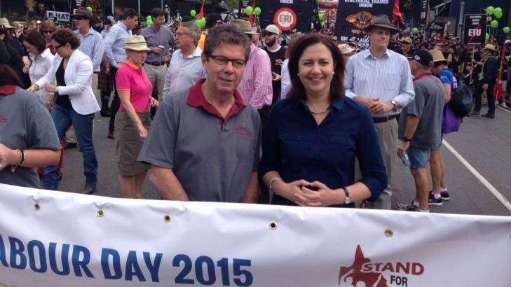 President of Queensland council of Unions John Battams with Premier Annastacia Palaszczuk at the Labour Day march. Photo: Tony Moore