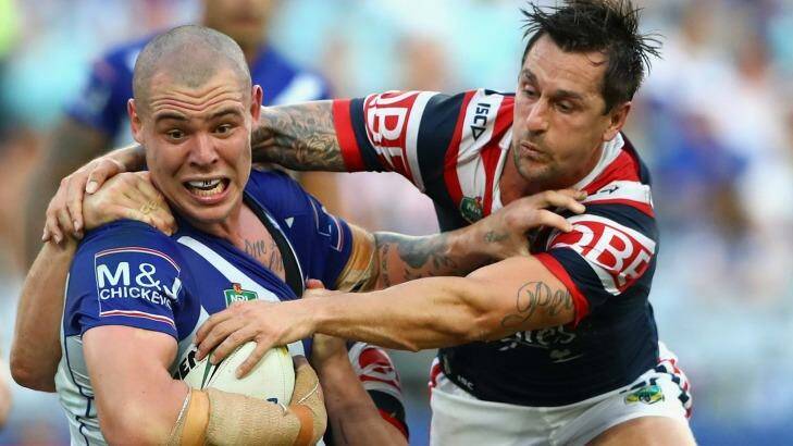 Powering on: David Klemmer takes Mitchell Pearce for a ride. Photo: Getty Images 
