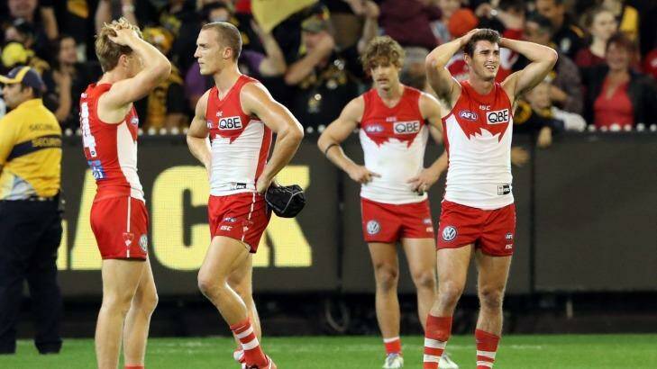 Sydney players show their disappointment at the narrow loss.