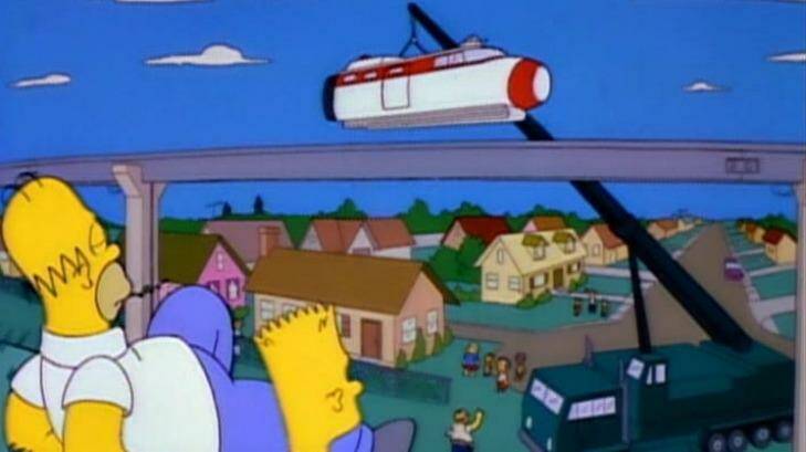 The Simpsons watch on as Springfield's monorail is built.