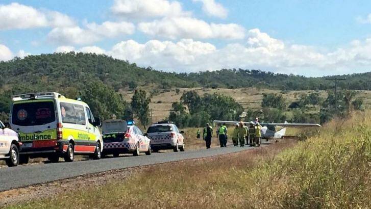 Emergency crews arrive at the scene where a light plane landed on the Capricorn Highway, about 25 kilometres south-west of Rockhampton. Photo: Tom Hartley/Seven News