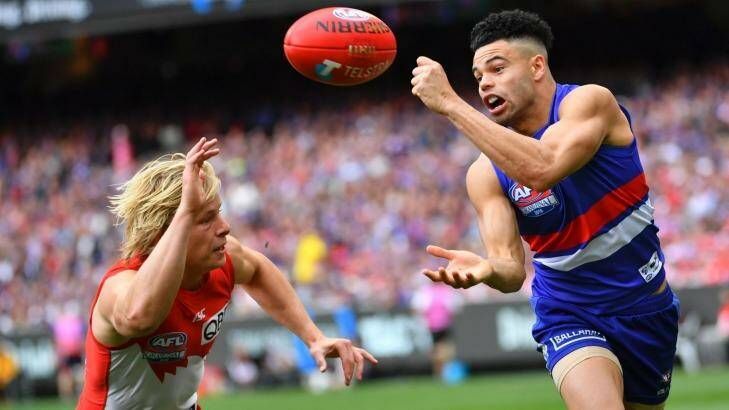Jason Johannisen on his way to the Norm Smith Medal. Photo: Eddie Jim