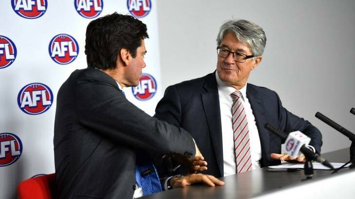 AFL CEO Gillon McLachlan shakes hands with Fitzpatrick after the latter announced his retirement. Photo: Joe Armao