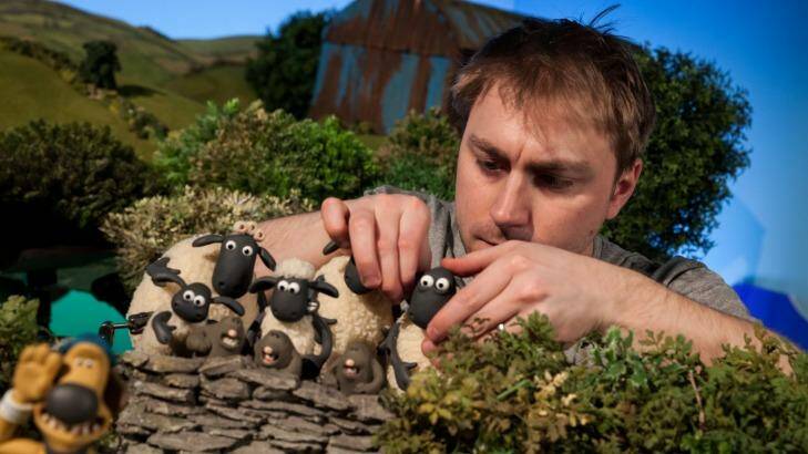 Animator Andy Shackleford poses the flock on <i>Shaun the Sheep</I>. Photo: Chris Johnson