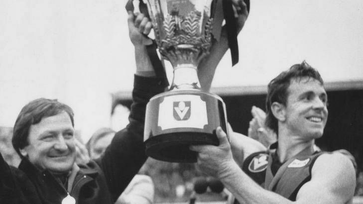 Terry Daniher lifts the 1985 premiership cup with Kevin Sheedy. Photo: Supplied