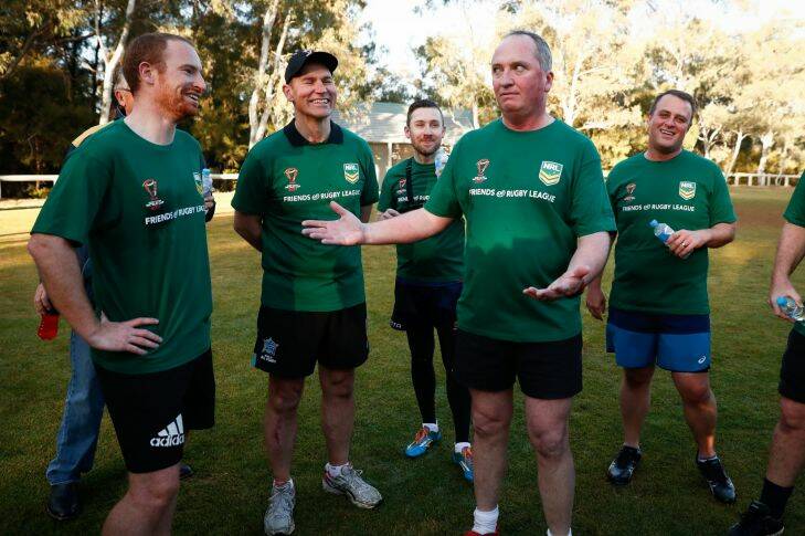 Deputy Prime Minister Barnaby Joyce gives his team a halftime talk during the Parliamentary Friends of Rugby League touch football game at the Senate Oval at Parliament House in Canberra on Wednesday 18 October 2017. fedpol Photo: Alex Ellinghausen