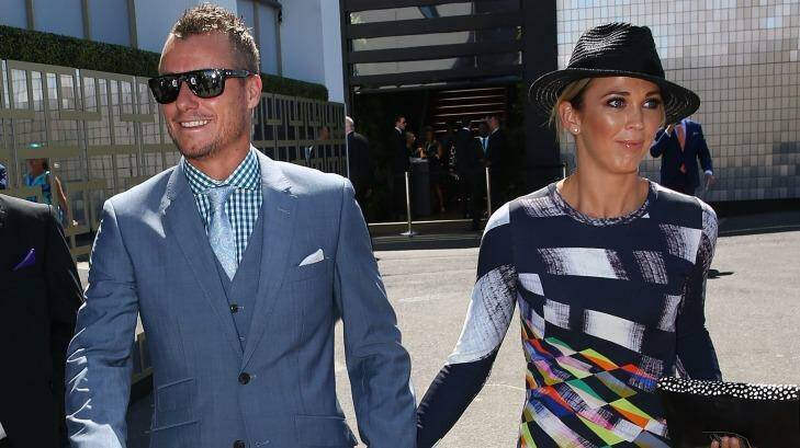Lleyton and Bec Hewitt arrive at the Swisse marquee.  Photo: Scott Barbour