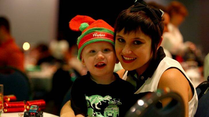 essica Carruthers with stepson Victor Somerville, 2, at the annual Salvation Army Christmas lunch at the Brisbane Convention and Exhibition Centre. Photo: Michelle Smith