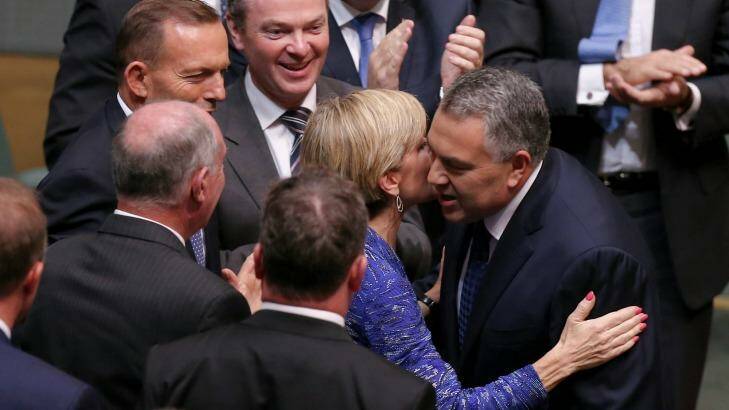Business has praised a "softer, cuddlier budget" from Treasurer Joe Hockey, seen here congratulated by Foreign Affairs Minister Julie Bishop after handing down the Budget. Photo: Alex Ellinghausen