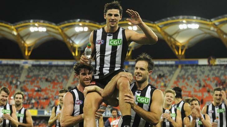 Collingwood captain Scott Pendlebury is chaired from the field after starring in his 200th AFL match. Photo: Matt Roberts