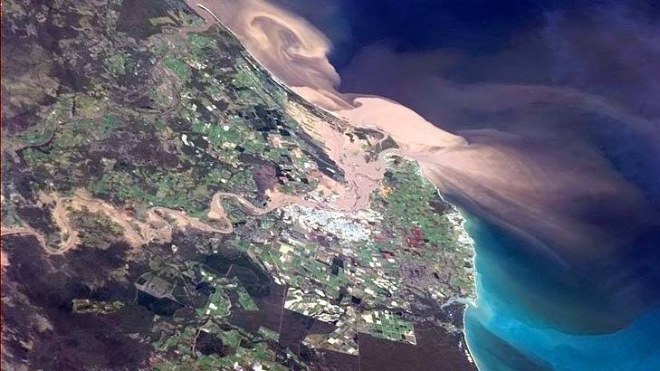 A satellite photo of sediment-laden plume moving out of the Burnett River at Bundaberg. Photo: Supplied