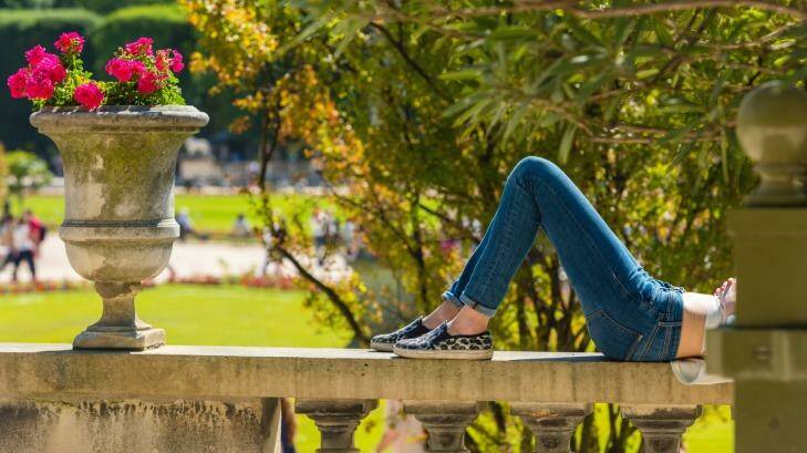 Relaxing in a park on a sunny summer day. Photo: iStock
