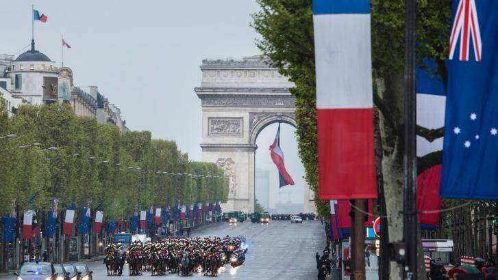 The Australian flag flying alongside the French tricolour on Anzac Day. Photo: Australian Embassy Paris
