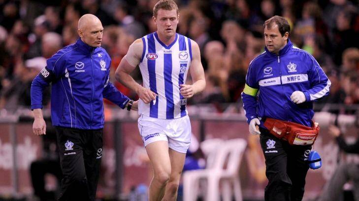 Lachie Hansen come off the ground after he was concussed in a clash during a 2012 game against Essendon. Photo: Sebastian Costanzo