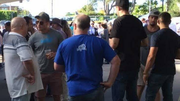 Kieran Foran, in blue T-shirt, cap and sunglasses, directly in front of Eddie Hasyon, at the Gosford Races on Anzac Day this year. Photo: Supplied